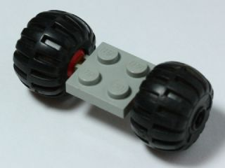 Part 122c01assy4 - Plate, Modified 2 x 2 with Red Wheels with 2 Black Wheel Full Rubber Balloon with Axle Hole (122c01 / 4288) - De BrickPlaats