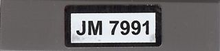 Part 2431pb0154 - Tile 1 x 4 with Black 'JM 7991' on White Background Pattern (Sticker) - Set 7991 - De BrickPlaats