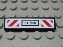 Part 2431pb0278 - Tile 1 x 4 with 'HA 7990' and Red and White Diagonal Stripes Pattern (Sticker) - Set 7990 - De BrickPlaats