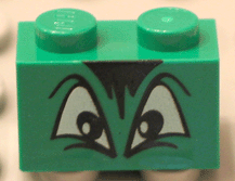 Part 3004pb012 - Brick 1 x 2 with Black and White Squinting Eyes and Hair Pattern - De BrickPlaats