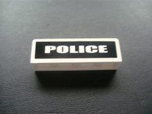 Part 30413pb019 - Panel 1 x 4 x 1 with White 'POLICE' on Black Background Pattern (Sticker) - Set 7236-1 - De BrickPlaats