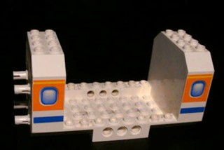 Part 42605pb03 - Aircraft Fuselage Angular Bottom 6 x 12 x 5 with Windows on Orange & Blue Stripes Pattern - De BrickPlaats