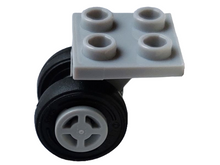 Part 4870c10 - Plate, Modified 2 x 2 Thin with Dual Wheels Holder - Split Pins with Light Bluish Gray Wheels with Slot and Black Tires (4870 / 34337 / 59895) - De BrickPlaats